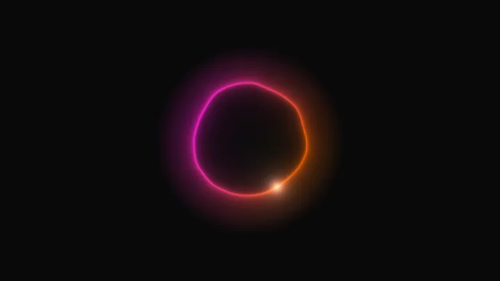 Halo orb: a glowing ring shading from pink to amber on black.